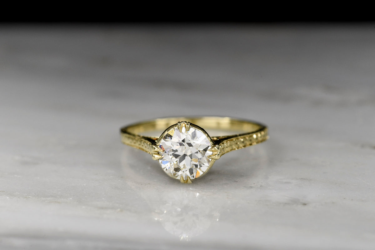 Early 1900s Ornate Gold Solitaire Engagement Ring with an Transitional Cut Diamond Center