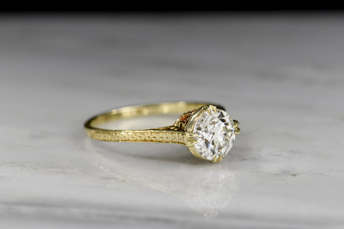 Early 1900s Ornate Gold Solitaire Engagement Ring with an Transitional Cut Diamond Center
