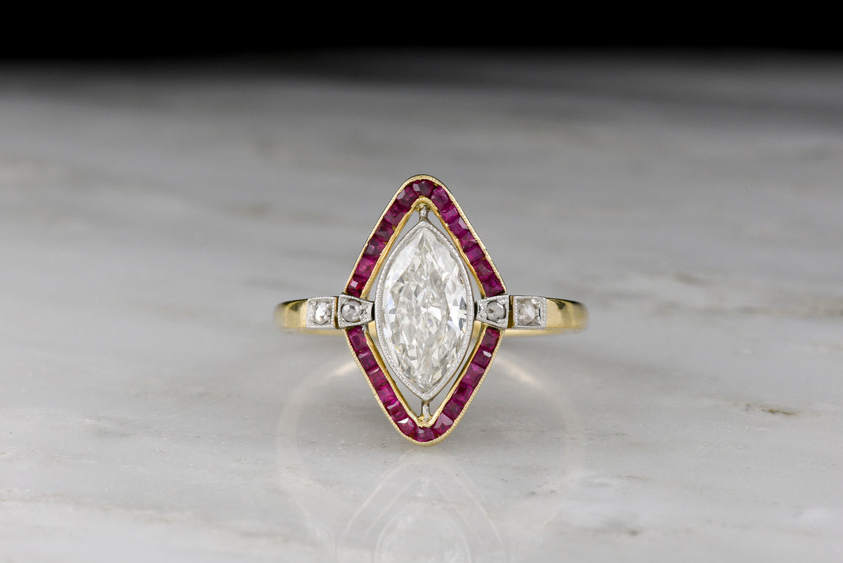 Shauna&#39;s Secret Stash: c. Early 1900s Belle Époque Two-Tone Ring with a Floating Marquise Cut Diamond and Ruby Surround