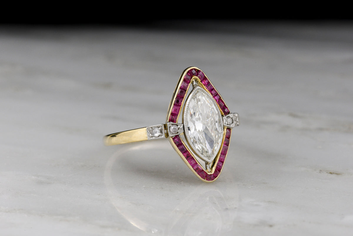 Shauna&#39;s Secret Stash: c. Early 1900s Belle Époque Two-Tone Ring with a Floating Marquise Cut Diamond and Ruby Surround
