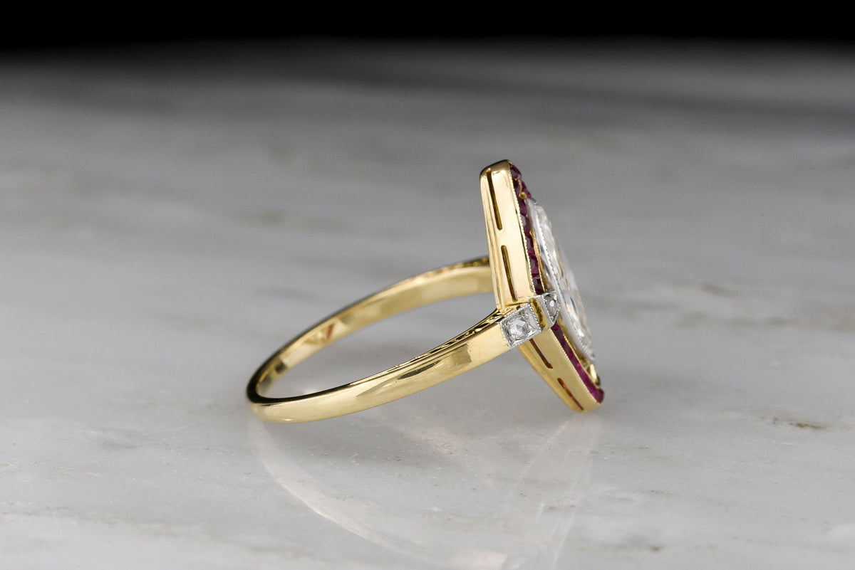 Shauna&#39;s Secret Stash: c. Early 1900s Belle Époque Two-Tone Ring with a Floating Marquise Cut Diamond and Ruby Surround