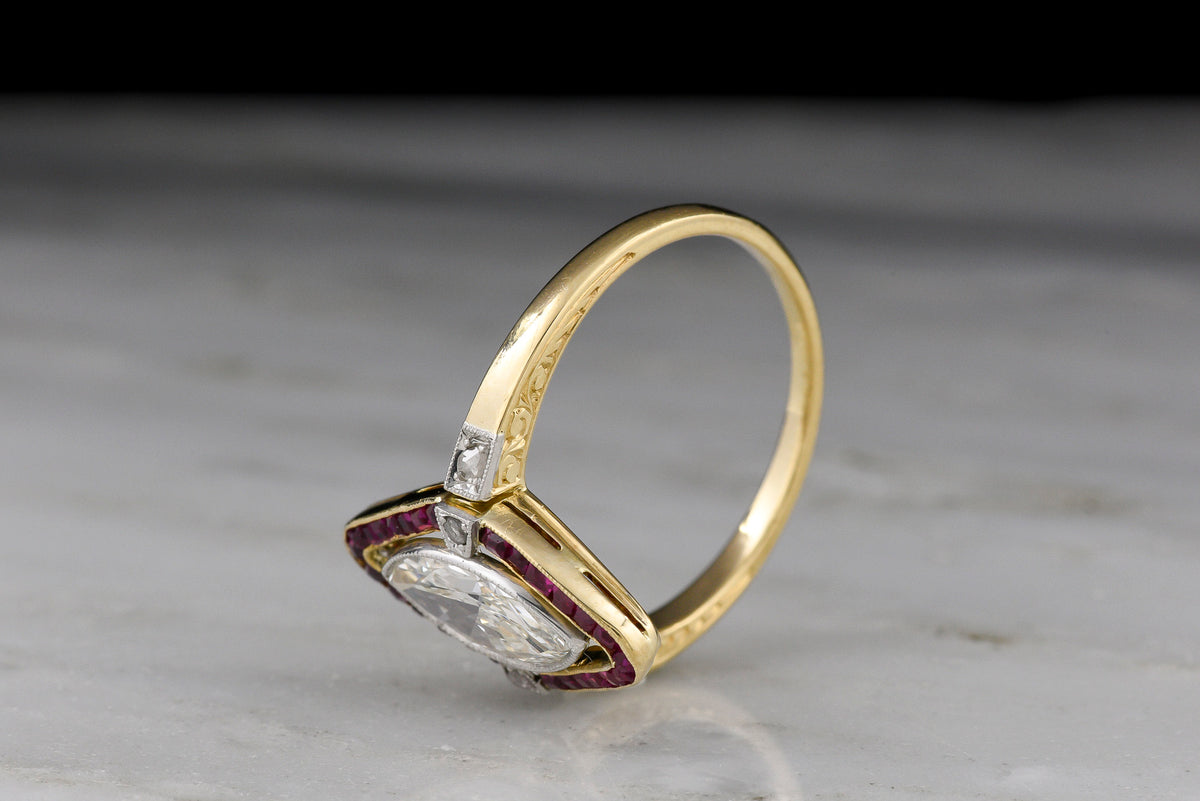 Shauna&#39;s Secret Stash: c. Early 1900s Belle Époque Two-Tone Ring with a Floating Marquise Cut Diamond and Ruby Surround