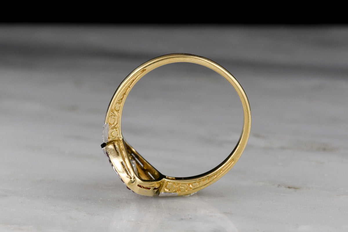Shauna&#39;s Secret Stash: c. Early 1900s Belle Époque Two-Tone Ring with a Floating Marquise Cut Diamond and Ruby Surround