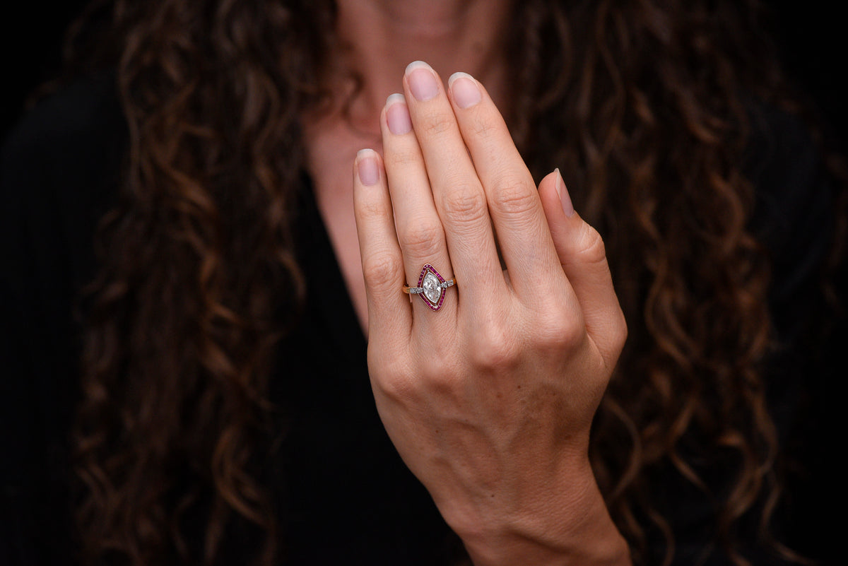 Shauna&#39;s Secret Stash: c. Early 1900s Belle Époque Two-Tone Ring with a Floating Marquise Cut Diamond and Ruby Surround