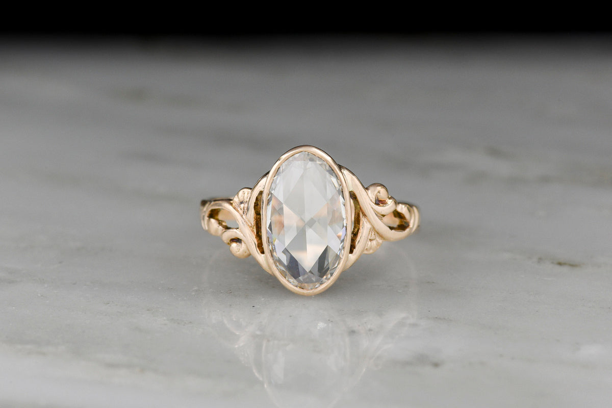 c. Early-Mid 1900s Engagement Ring with Art Nouveau / Vienna Succession Shoulders and an Oval Rose Cut Diamond Center