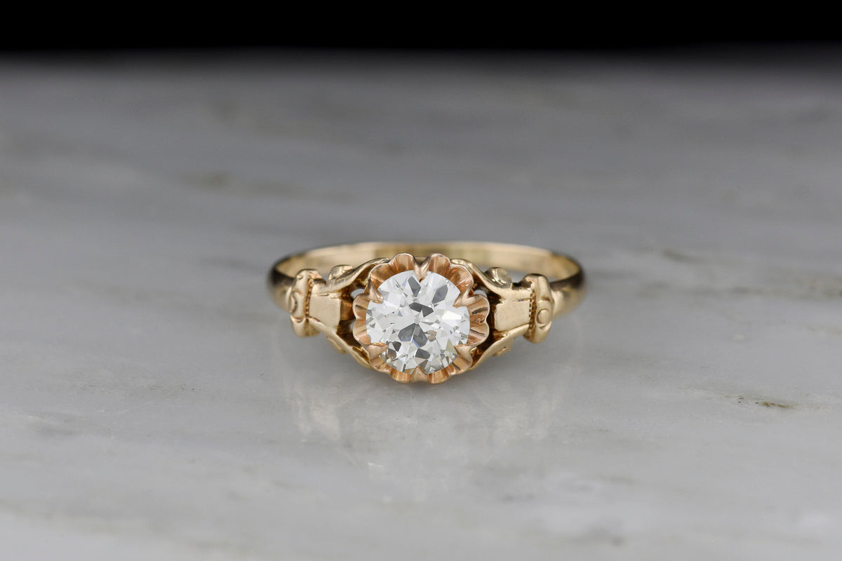 c. 1900 Buttercup Solitaire Engagement Ring with Unique Capital Shoulders