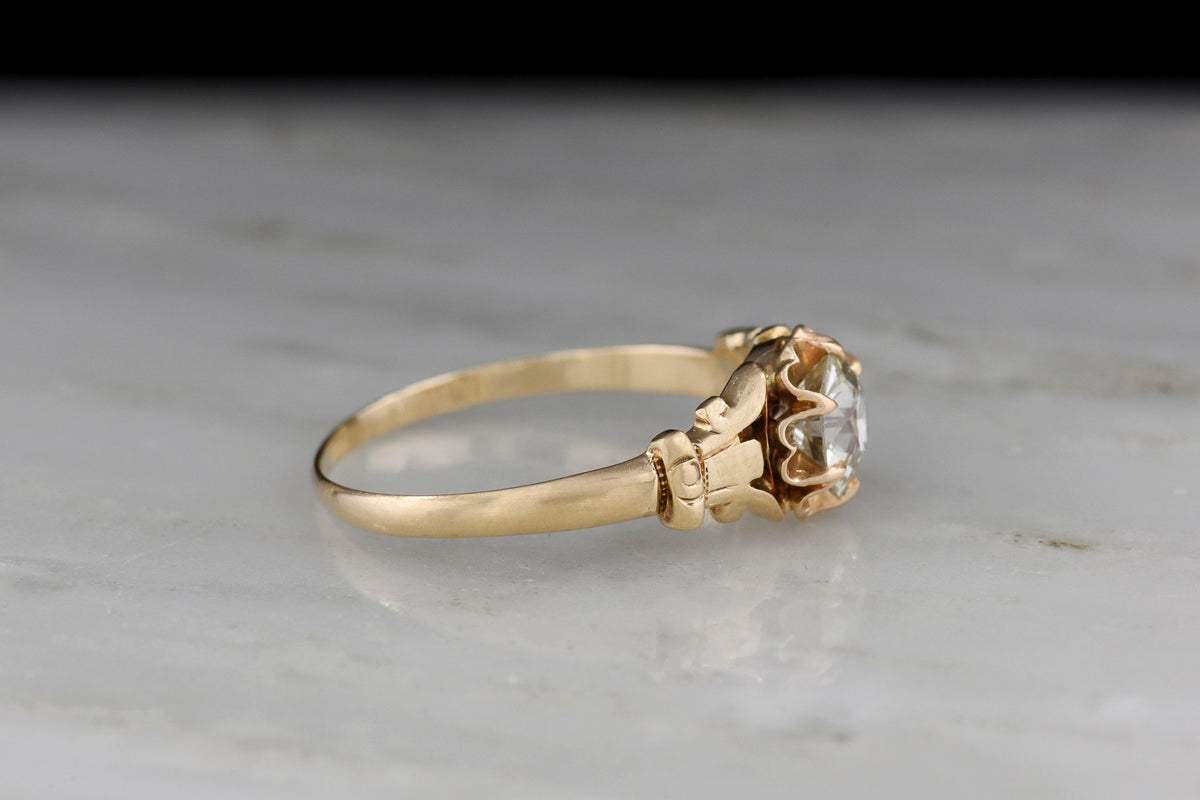 c. 1900 Buttercup Solitaire Engagement Ring with Unique Capital Shoulders