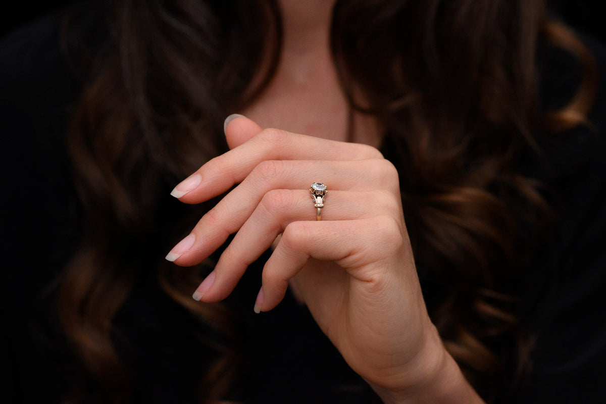 c. 1900 Buttercup Solitaire Engagement Ring with Unique Capital Shoulders