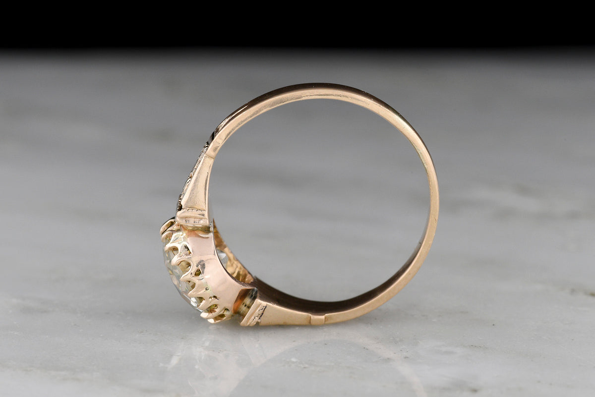 Victorian Engagement Ring with a Floating Basket and Intricate Shoulders