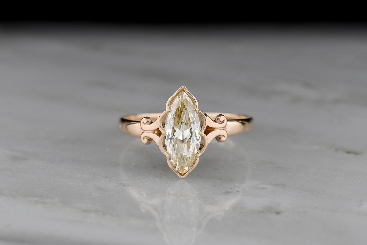 c. Early 1900s Gold Engagement Ring with a Marquise Cut Diamond and Subtle Split Shank