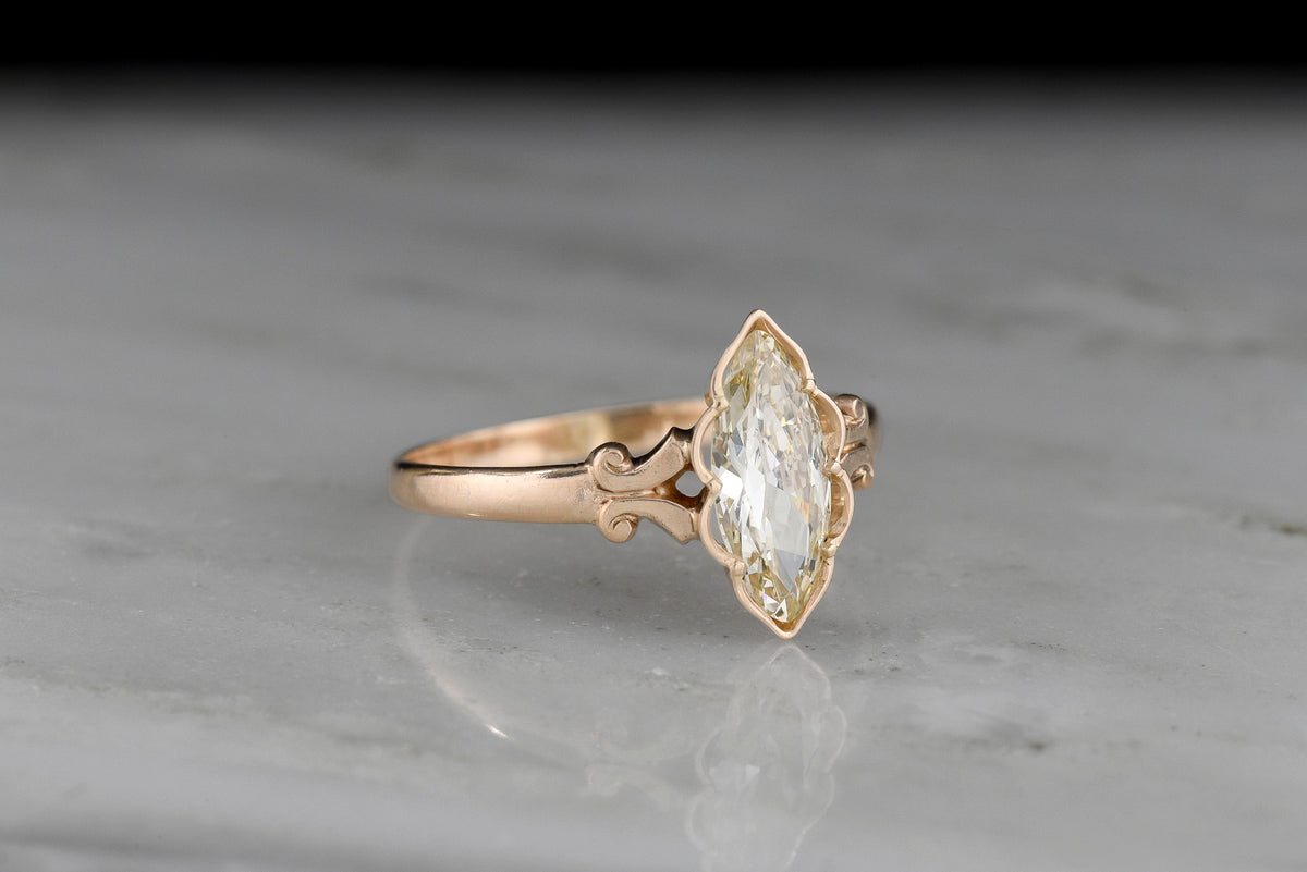 c. Early 1900s Gold Engagement Ring with a Marquise Cut Diamond and Subtle Split Shank