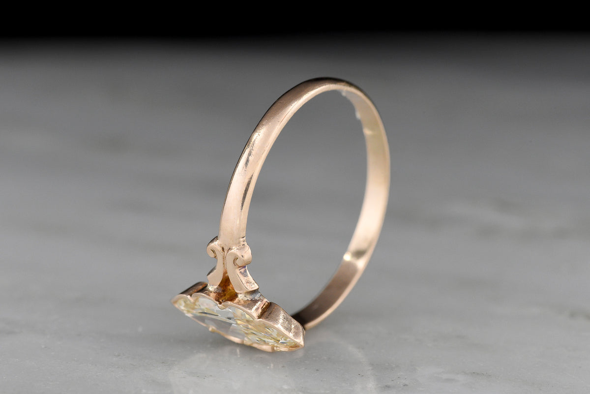 c. Early 1900s Gold Engagement Ring with a Marquise Cut Diamond and Subtle Split Shank
