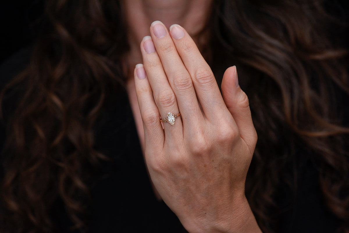 c. Early 1900s Gold Engagement Ring with a Marquise Cut Diamond and Subtle Split Shank