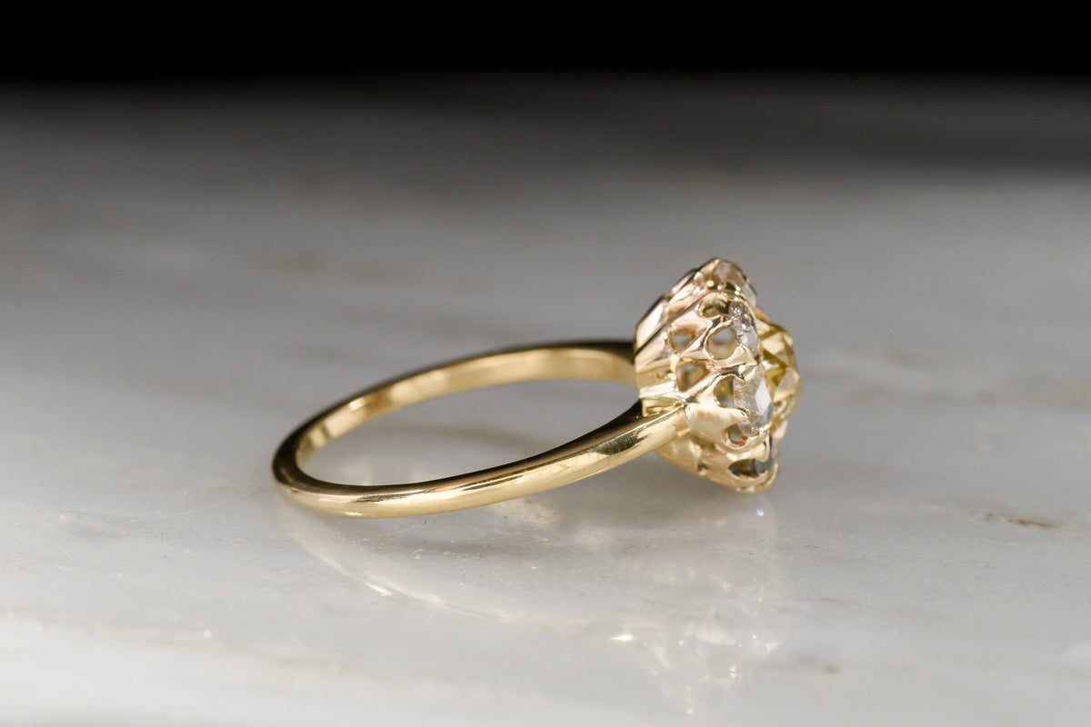 Mid-Late 1800s Cluster Ring with a Fancy Yellow Old Mine Cut Diamond Center