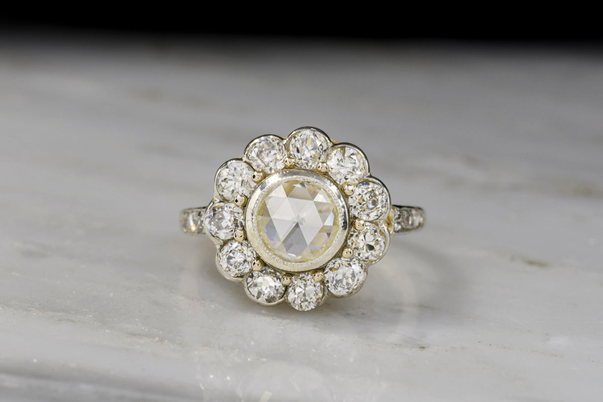 Viennese Belle Époque Gold and Platinum Cluster Ring with a Round Rose Cut Diamond Center