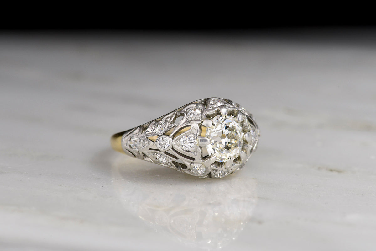 c. 1910 Late Belle Époque Open Metalwork Gold and Platinum Ring with an Old Mine Center