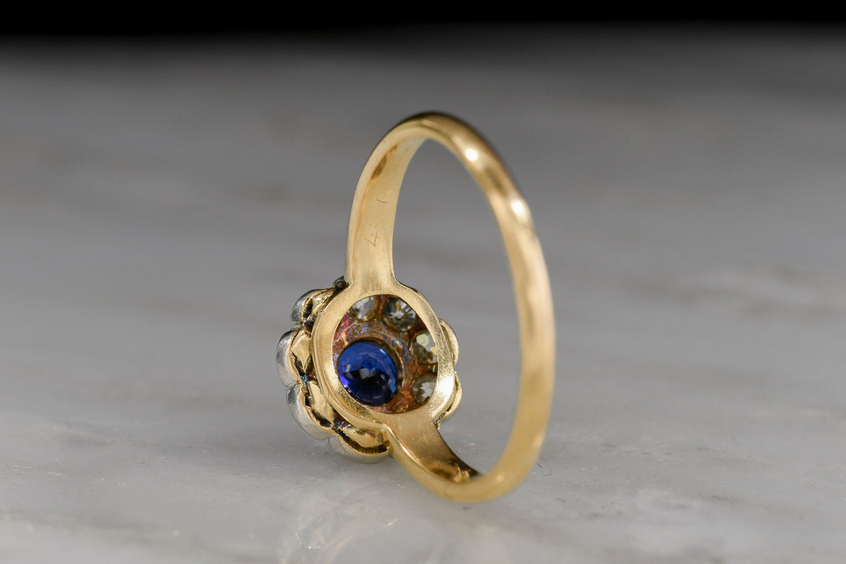 Deep Blue Sapphire and Diamond Cluster Ring in 18K Gold and Platinum