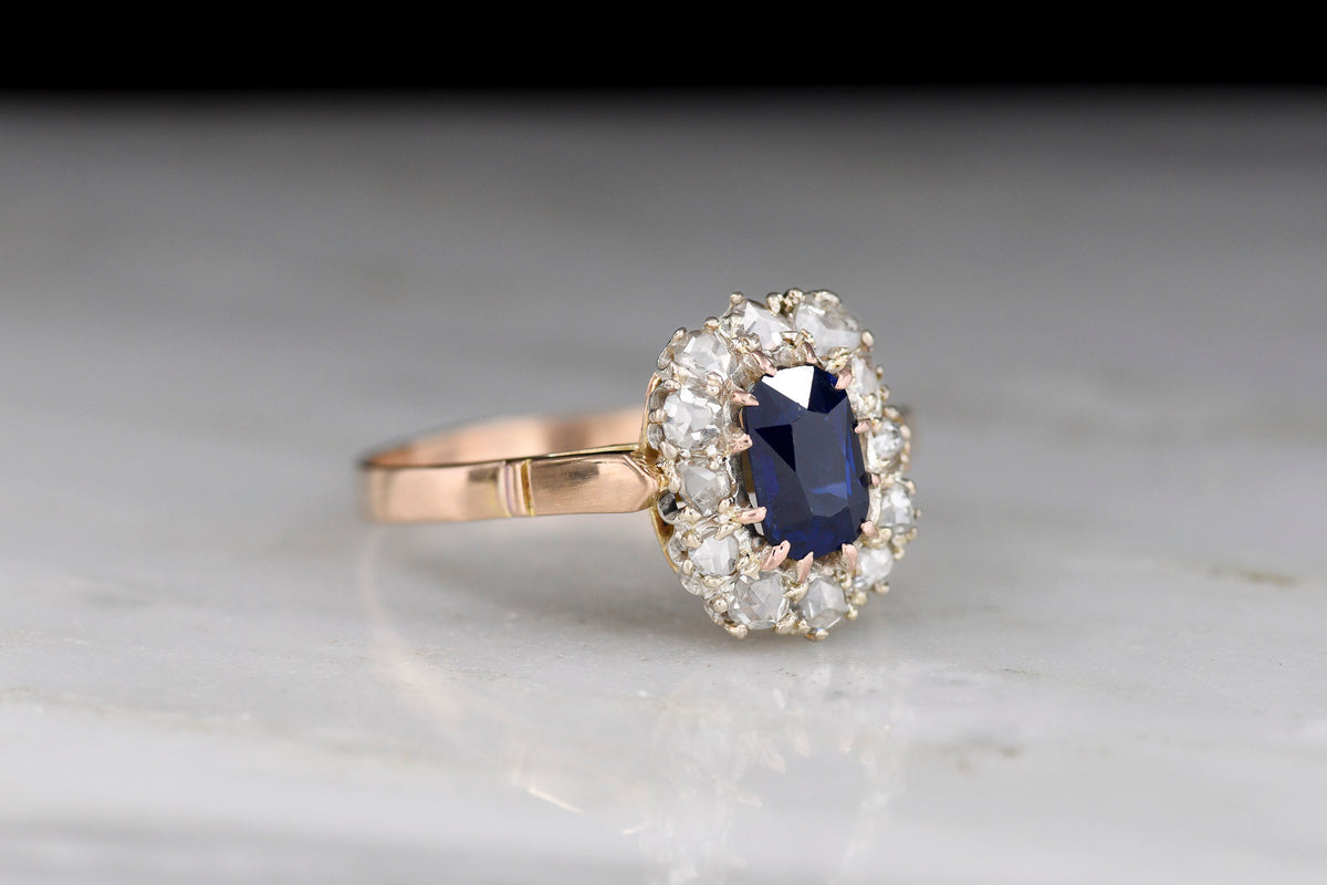 c. Late 1800s Cluster Ring with an Elongated Cushion Sapphire and Rose Cut Diamonds