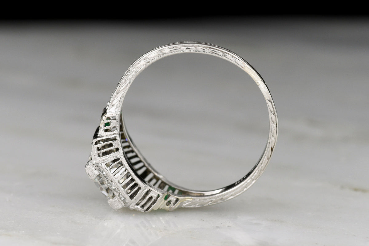 Art Deco Engagement Ring with Stepwise Graduation, Balustrade Gallery, and Emerald Accents