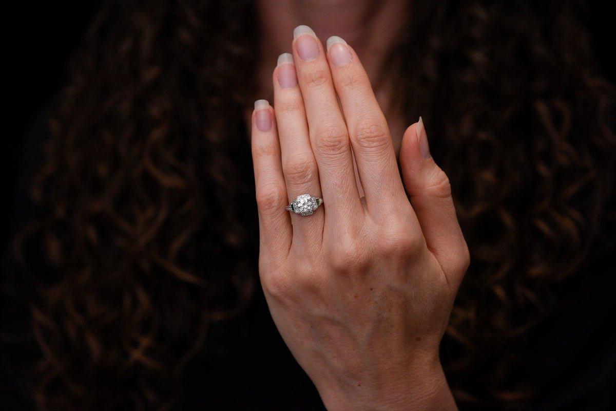 Art Deco Engagement Ring with Stepwise Graduation, Balustrade Gallery, and Emerald Accents