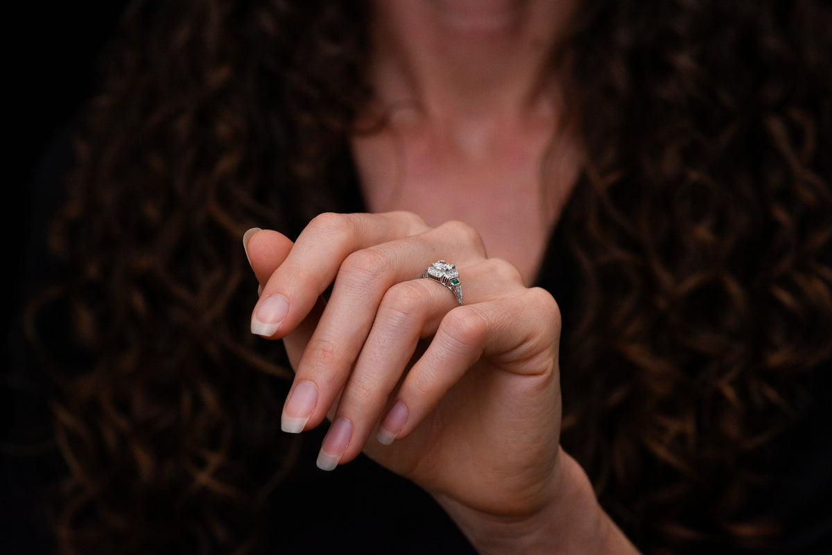 Art Deco Engagement Ring with Stepwise Graduation, Balustrade Gallery, and Emerald Accents