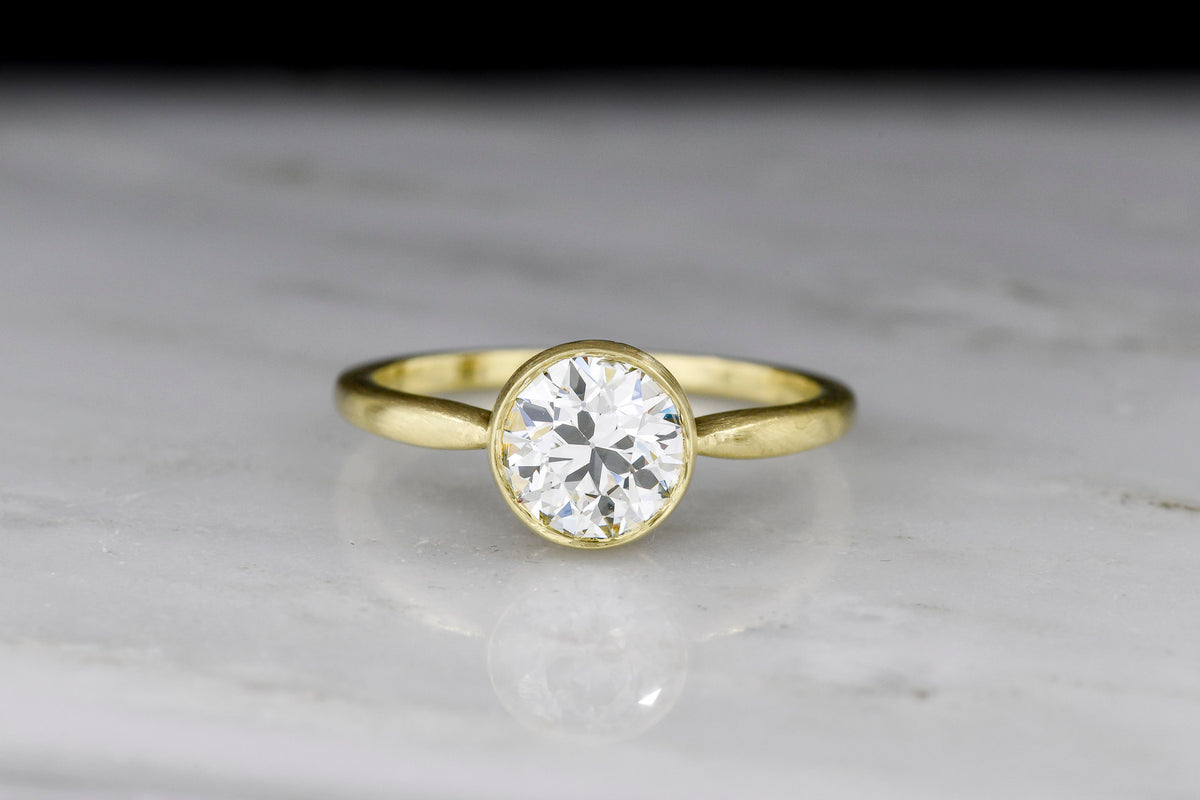 Pebble &amp; Polish Original: Classic Solitaire in 18K with a Rounded Top and Peek-a-Boo Basket