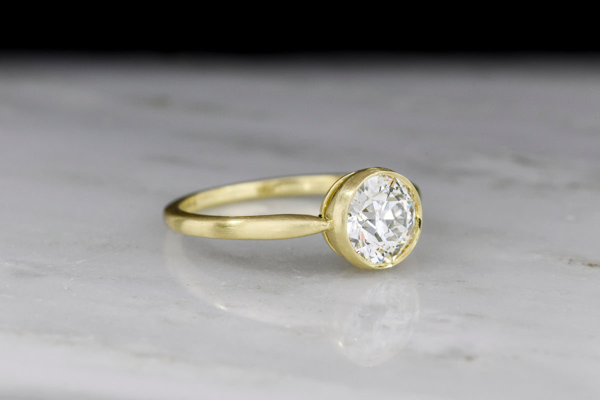 Pebble &amp; Polish Original: Classic Solitaire in 18K with a Rounded Top and Peek-a-Boo Basket