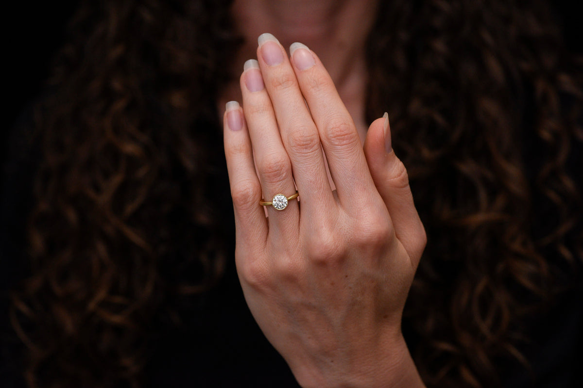 Pebble &amp; Polish Original: Classic Solitaire in 18K with a Rounded Top and Peek-a-Boo Basket