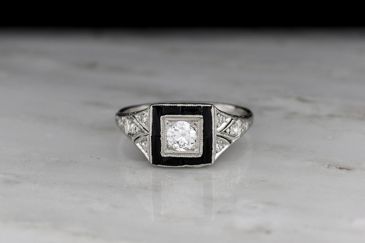 Early Art Deco Platinum Ring with Hand-Pierced Shoulders and Onyx Accents