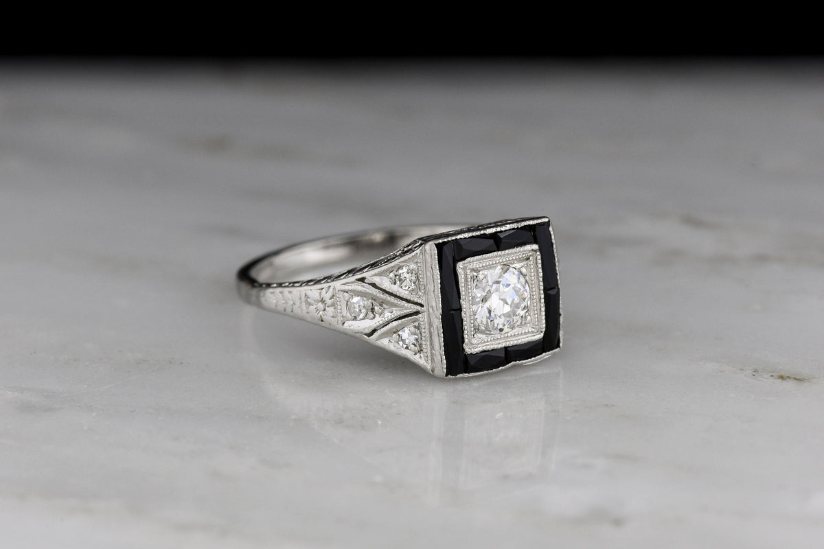 Early Art Deco Platinum Ring with Hand-Pierced Shoulders and Onyx Accents