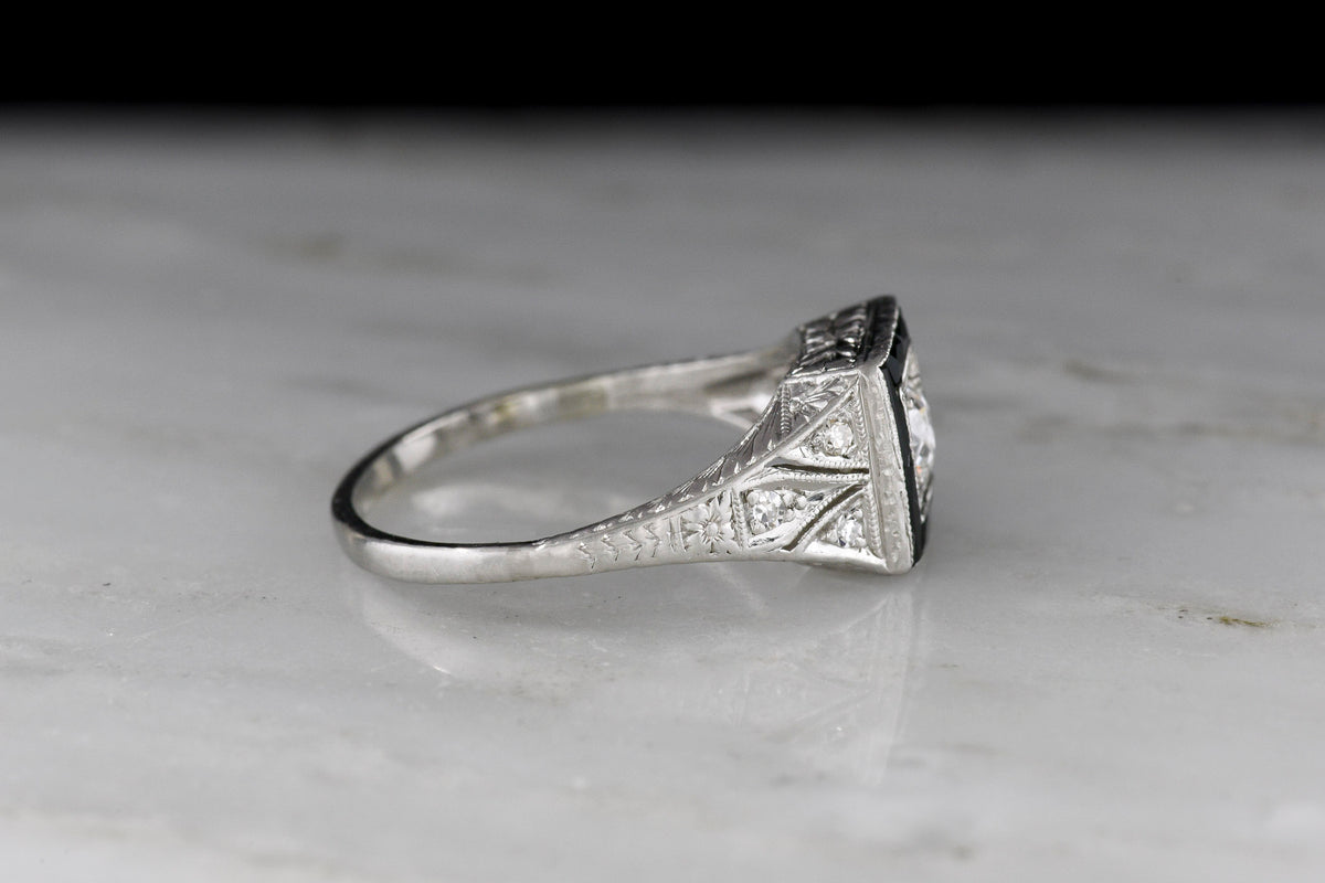 Early Art Deco Platinum Ring with Hand-Pierced Shoulders and Onyx Accents