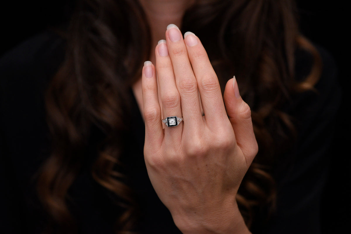 Early Art Deco Platinum Ring with Hand-Pierced Shoulders and Onyx Accents