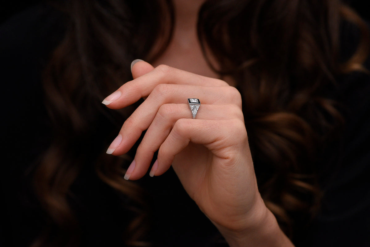 Early Art Deco Platinum Ring with Hand-Pierced Shoulders and Onyx Accents