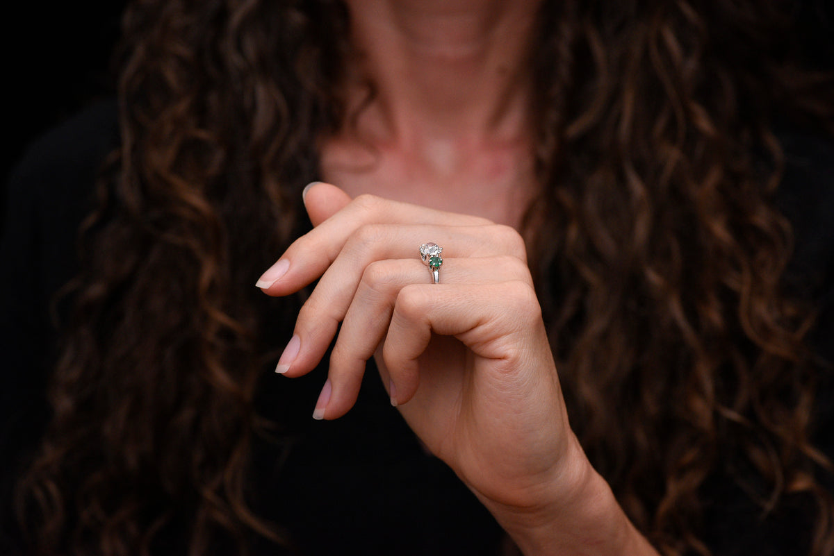 Vintage Three Stone Engagement Ring with a 1.68 Carat Old Mine Cut Diamond and Two Round Emeralds