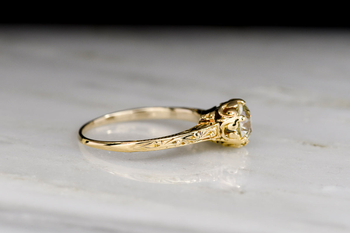 c. 1900 - 1920s Hand-Engraved Gold Solitaire Engagement Ring with a Subtle Fleur de Lis Basket