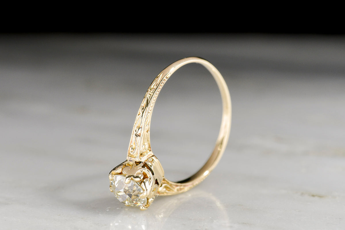 c. 1900 - 1920s Hand-Engraved Gold Solitaire Engagement Ring with a Subtle Fleur de Lis Basket