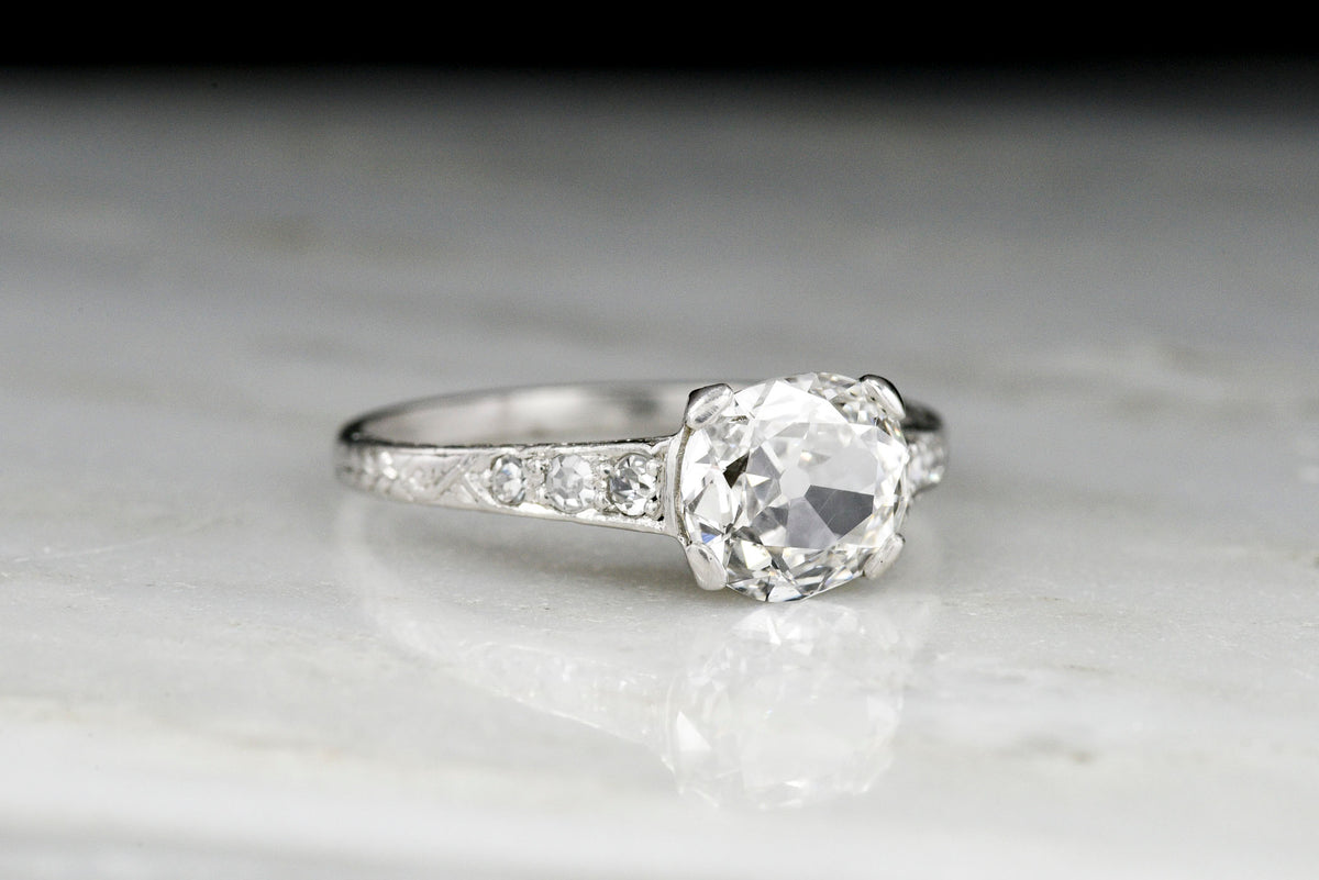 Edwardian Platinum Engagement Ring with an Old Mine Cushion Cut Diamond Center