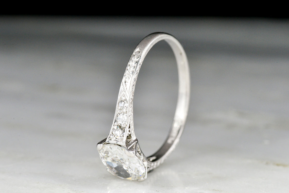 Edwardian Platinum Engagement Ring with an Old Mine Cushion Cut Diamond Center