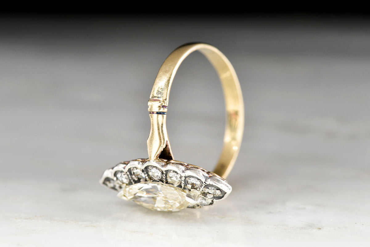 Victorian Gold and Silver Navette Ring with a Marquise Cut Diamond Center