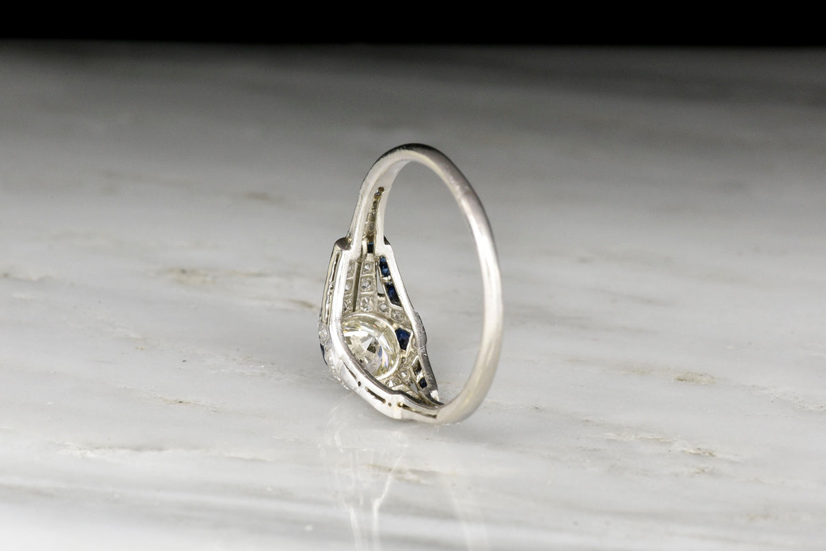 Art Deco Diamond and Sapphire Ring with a Transitional Cut Diamond Center