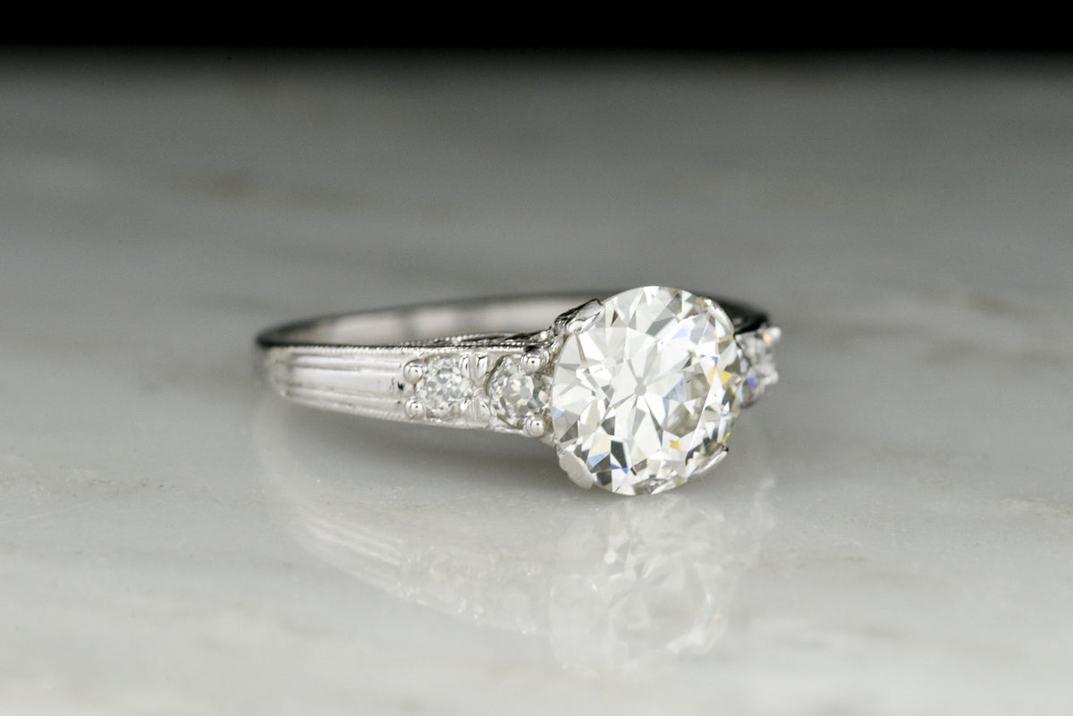 c. 1920s Engraved Platinum Engagement Ring with a 1.44 Carat Old European Cut Diamond Center