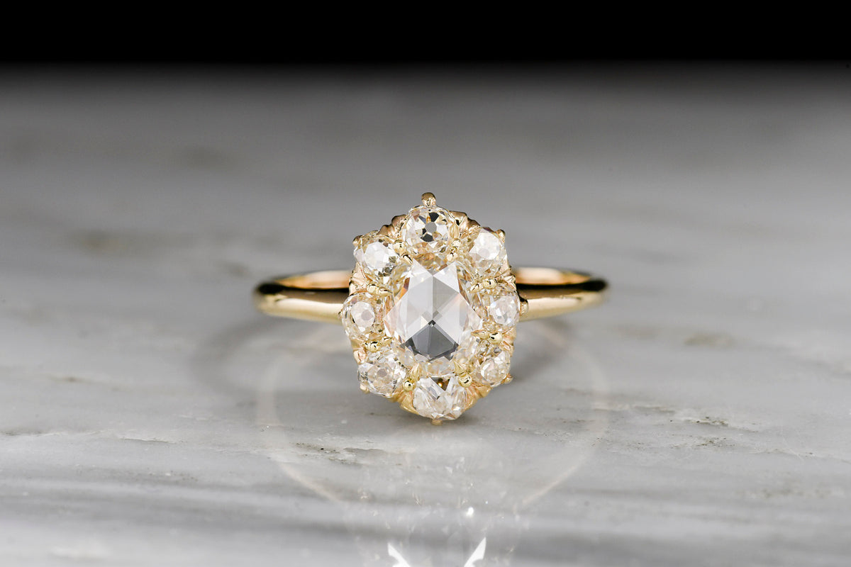 Late Victorian Oval Rose Cut Diamond Cluster Ring with Old Mine Cut Diamond Accents