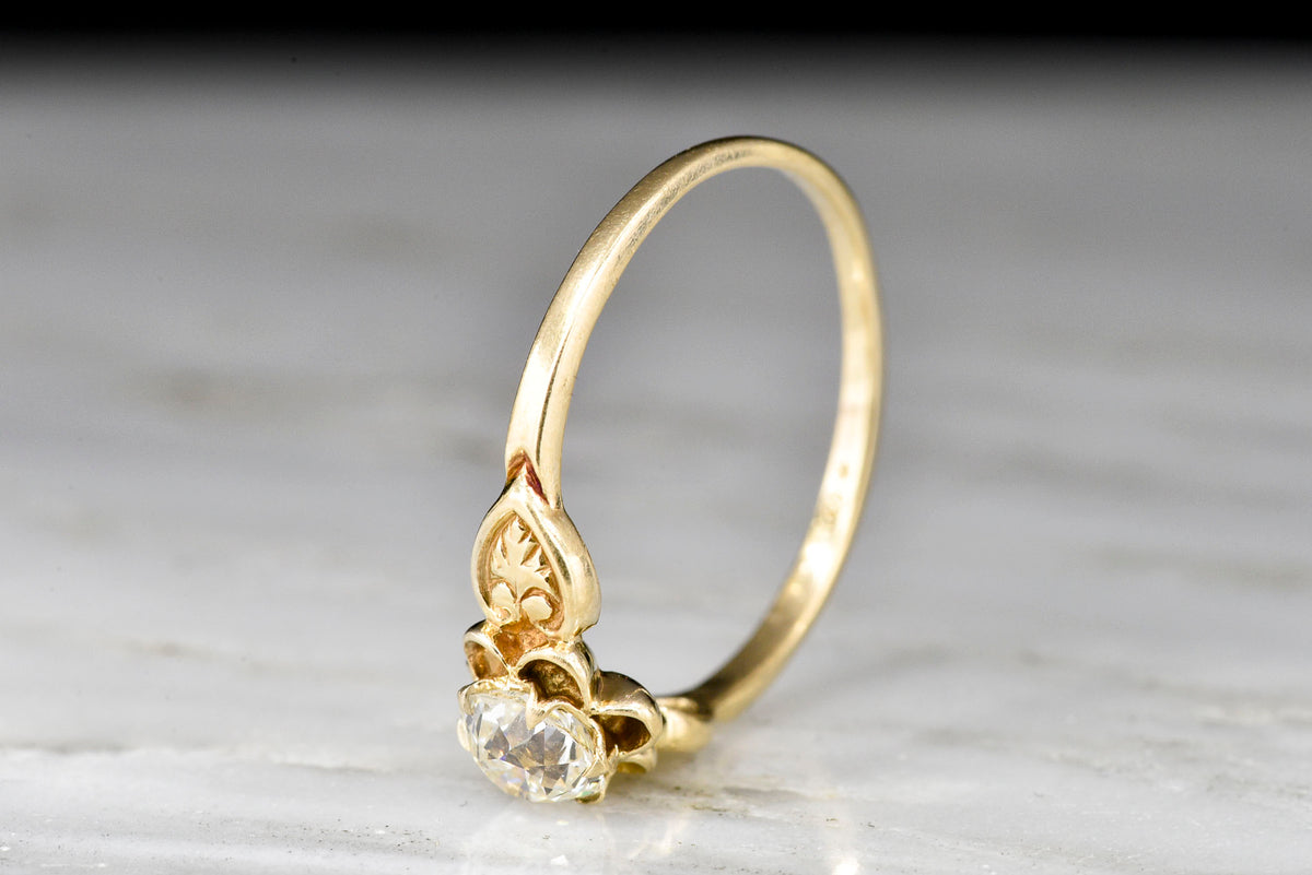 Post-Victorian Solitaire Buttercup Engagement Ring with an Old European Cut Diamond Center