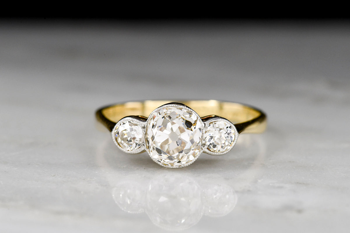 c. 1900-1910 Belle Époque Gold and Platinum Three Stone Old Mine Cut Diamond Ring