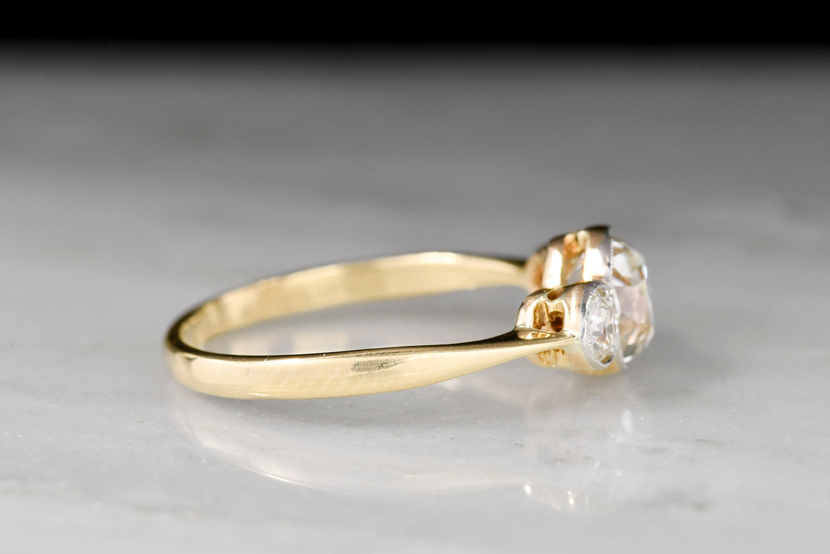 c. 1900-1910 Belle Époque Gold and Platinum Three Stone Old Mine Cut Diamond Ring