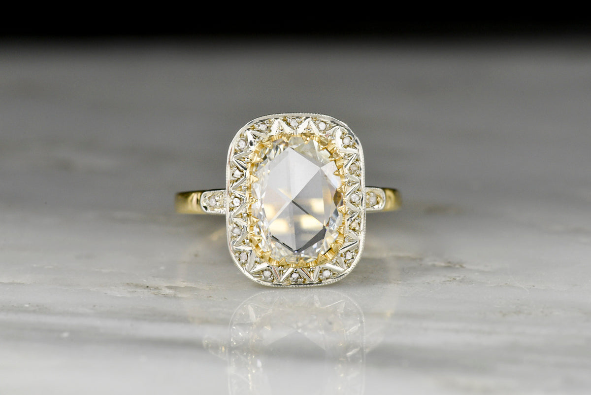 Late Belle Époque Gold and Platinum Ring with an Oval Rose Cut Diamond Center