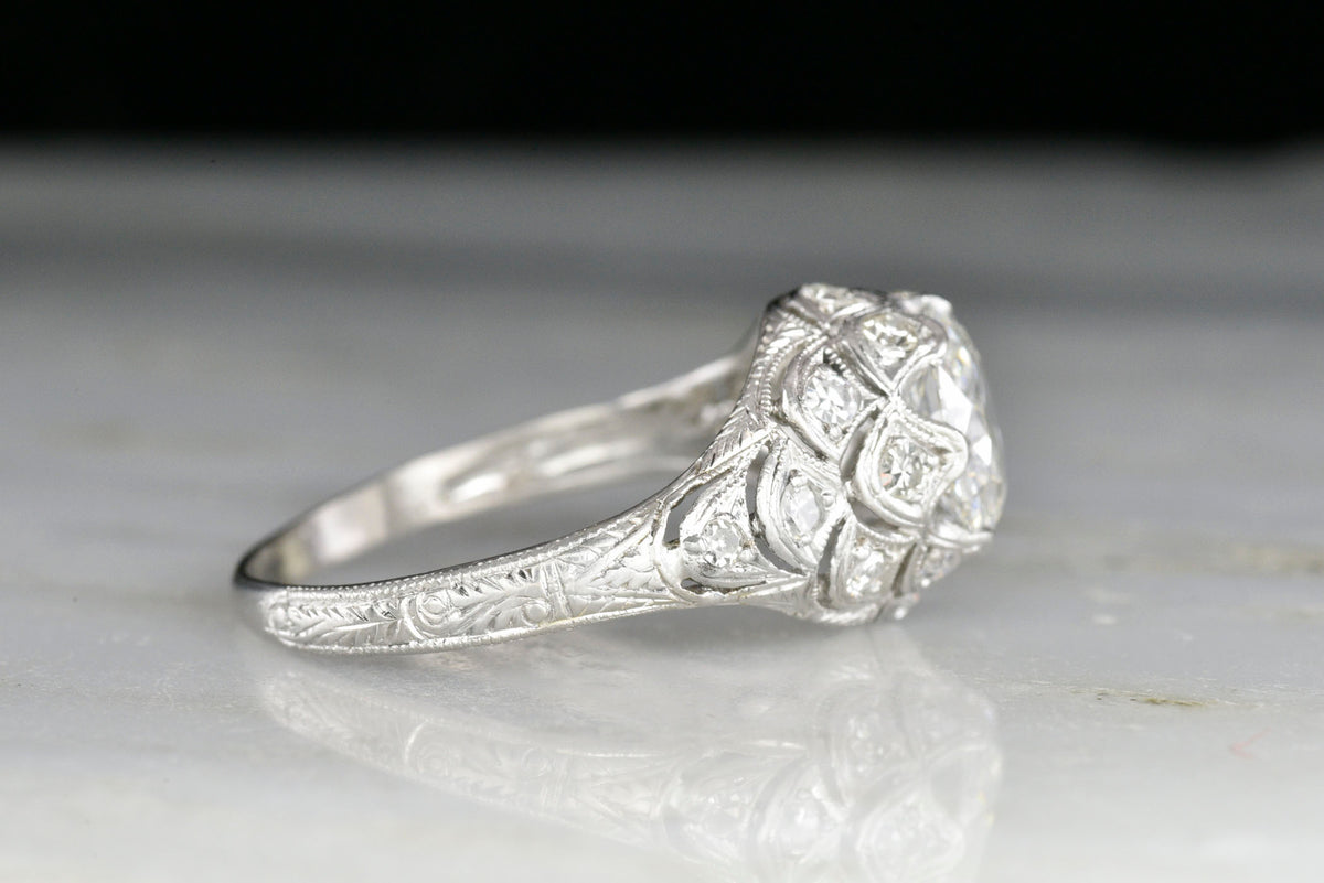 Ornate Hand-Pierced Edwardian Platinum Ring with an Art-Nouveau-Inspired Scallop Motif