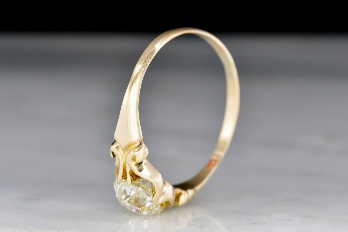 East-West Oriented Gold Engagement Ring with an Old Mine Cut Diamond Center