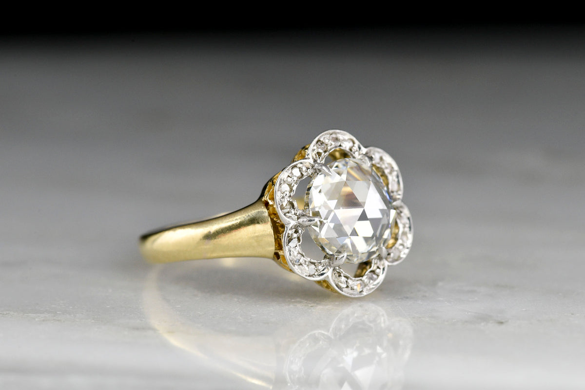 Belle Époque Gold and Platinum Ring with a Floating Floral Halo and Rose Cut Diamond Center
