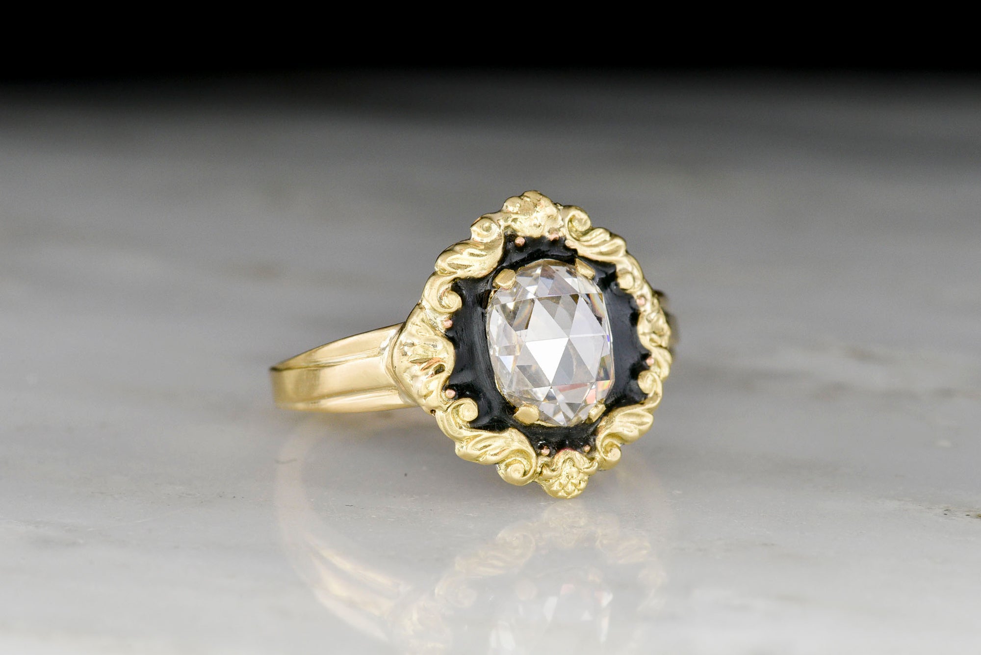 Victorian / Rococo Gold Ring with Black Enamel and an Antique Oval Rose Cut Diamond